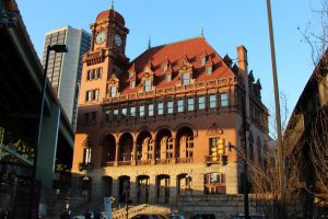 Beautiful golden facade with tower clock and red roof at Richmond Main Street Station