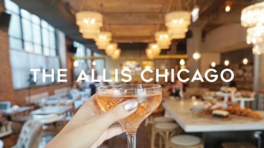 The Allis Chicago lifting a glass of rose