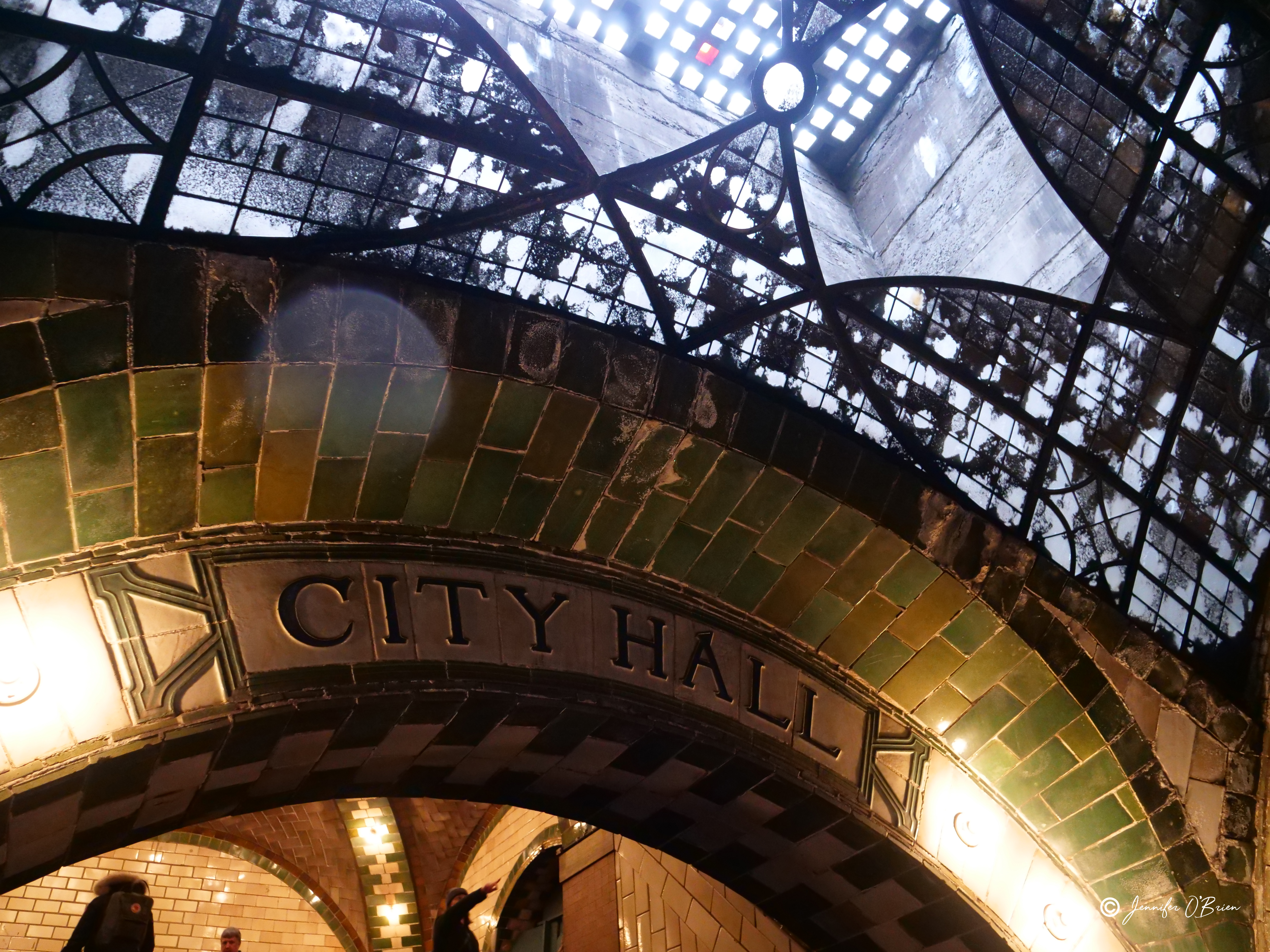 Lady pointing at sign NYC Abandoned City Hall Subway Station Photo Challenge