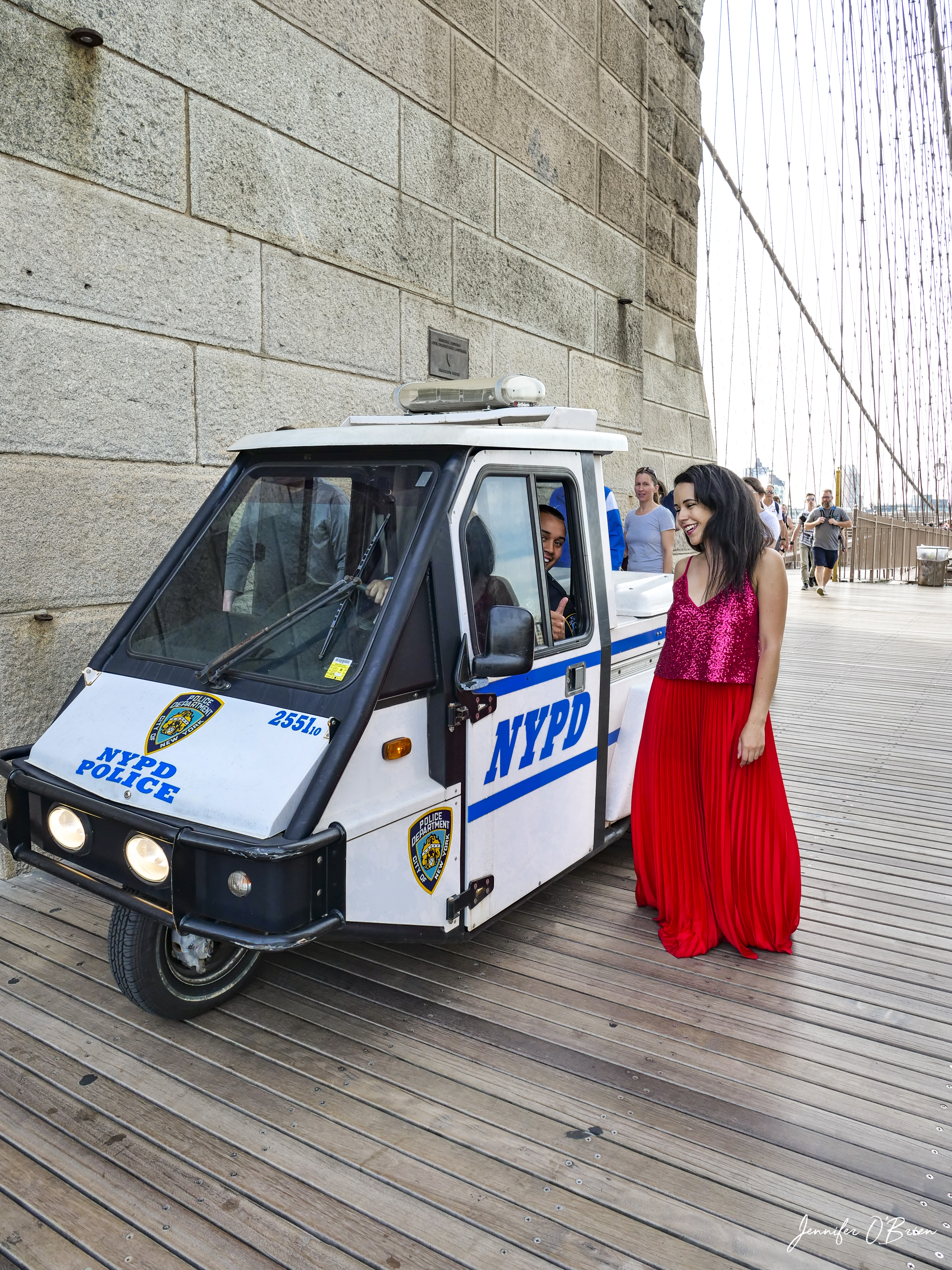 Top Instagram Photos of the Brooklyn Bridge The Travel Women Tower NYPD police smiling NYC bike mini car