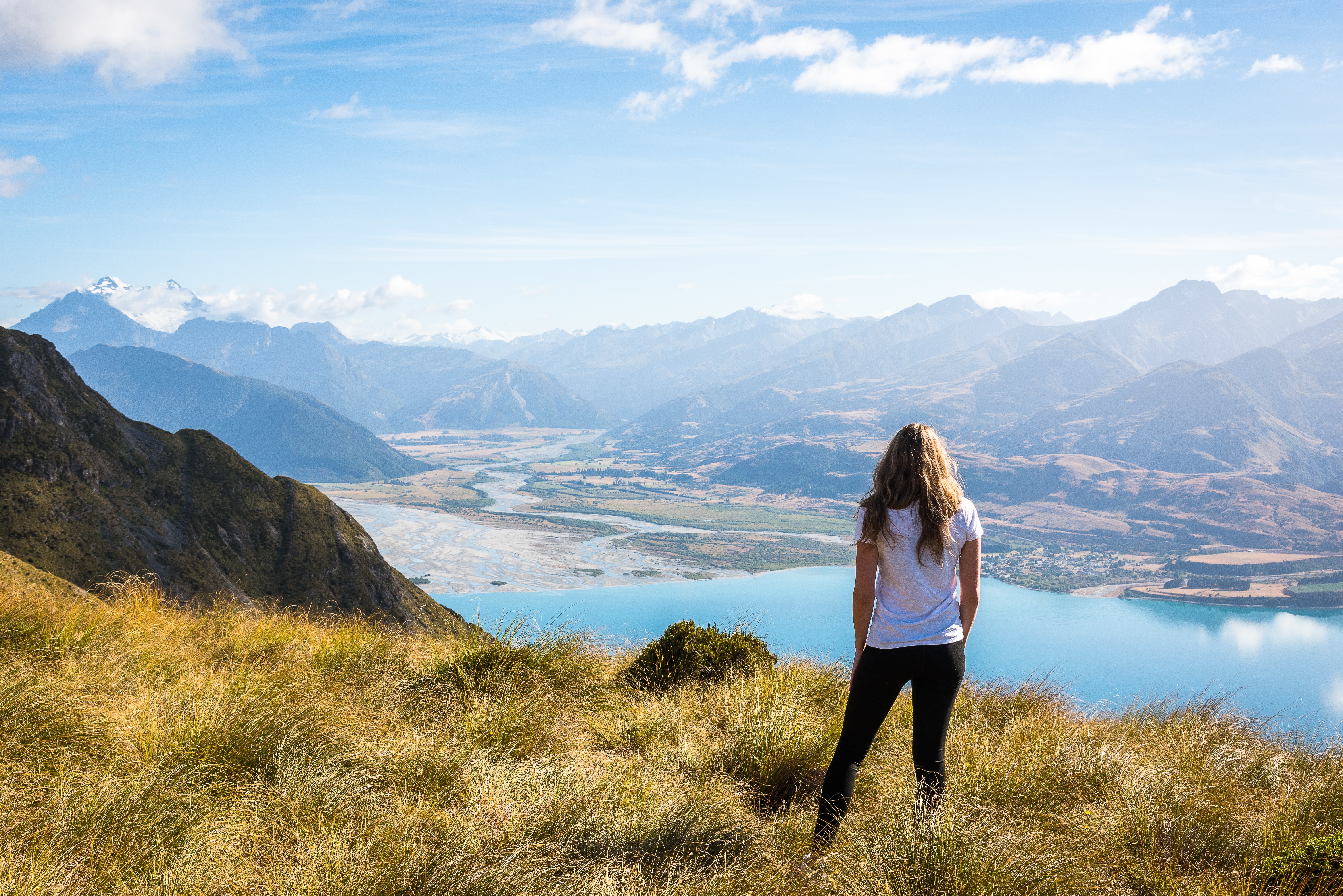 New Zealand woman overlooking mountains