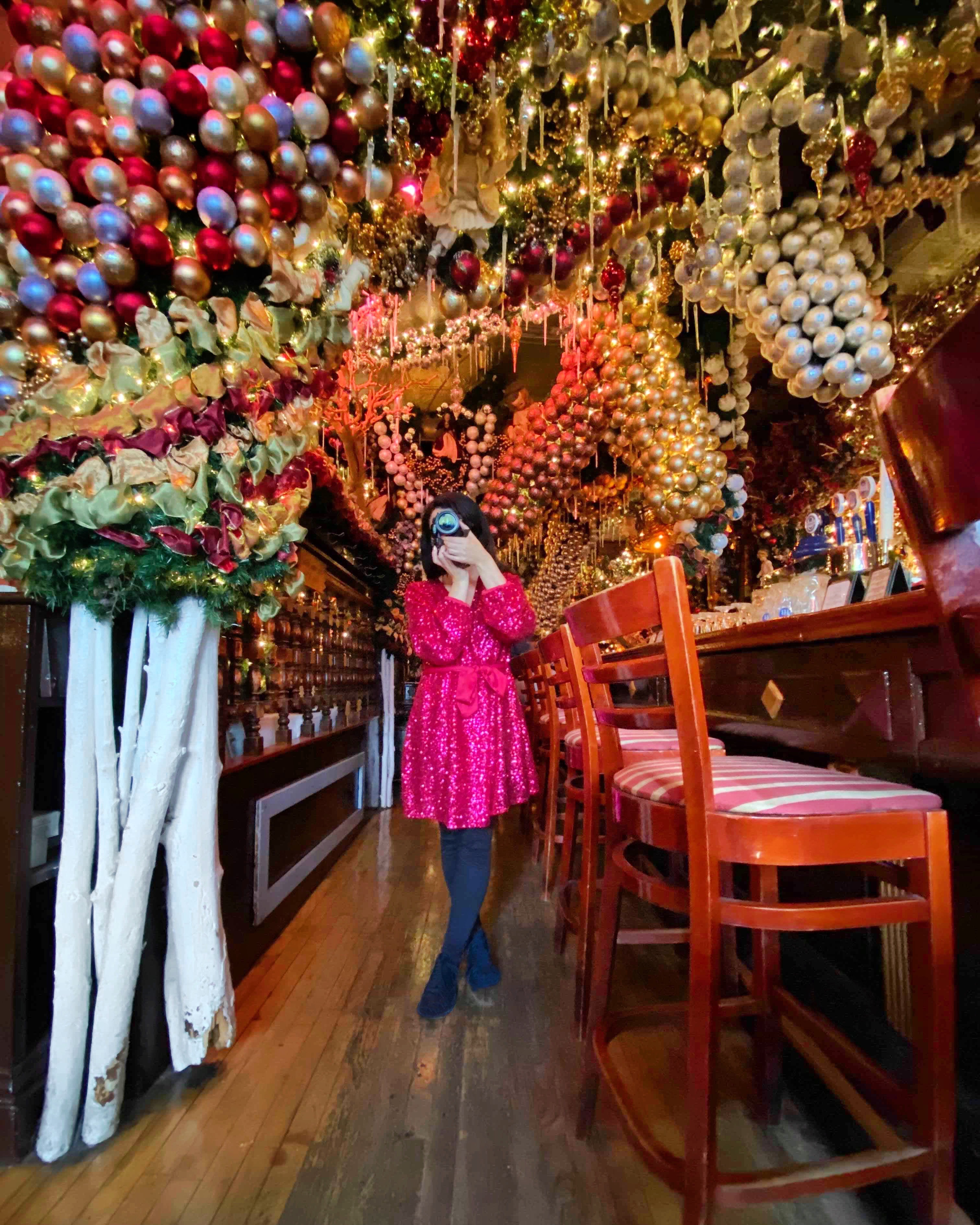 Rolfs German Restaurant NYC holidays best bar woman with camera