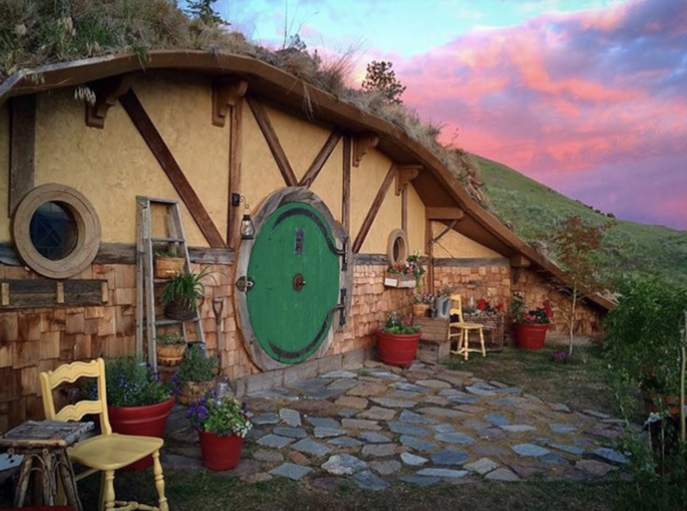 Hobbit and Lord of the Rings Airbnb homes and houses in the USA round door sunset