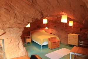 Most Unique USA Airbnbs Navajo sandstone home cave Boulder Utah bedroom