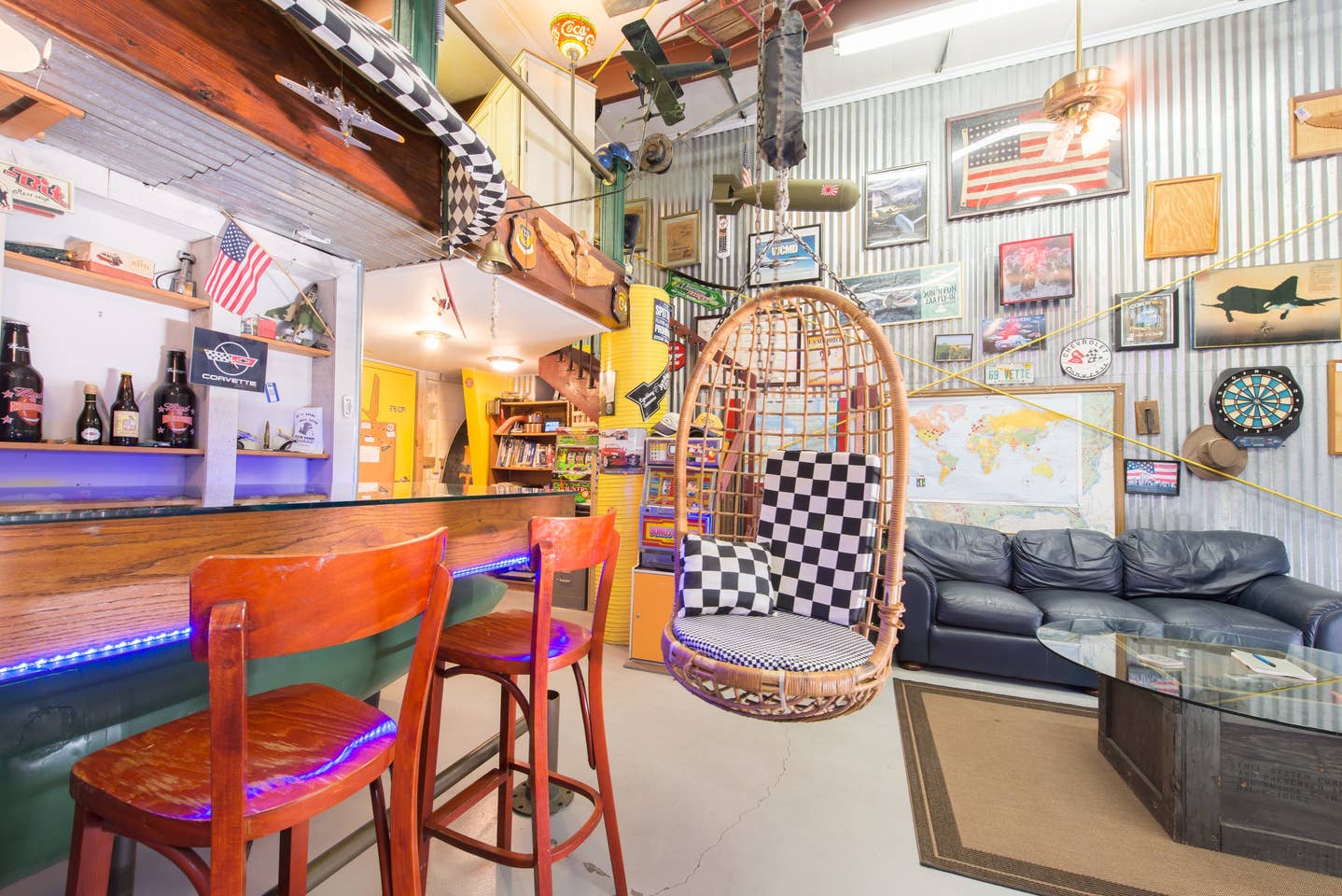 Most Unique USA Airbnbs man cave airplane hanger hanging wooden chair