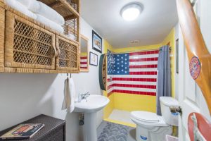 Most Unique USA Airbnbs man cave airplane hanger bathroom American Flag