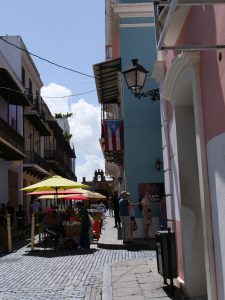 San Juan Puerto Rico secrets street with umbrellas huge Puerto Rican flag