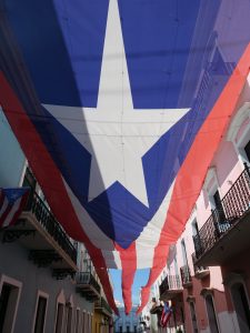 San Juan Puerto Rico secrets street with umbrellas huge Puerto Rican flag