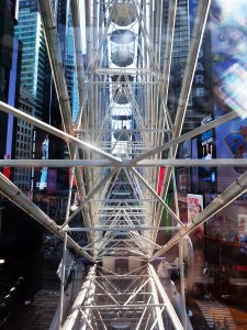 Times Square ferris wheel NYC view inside the metal spokes of the wheel