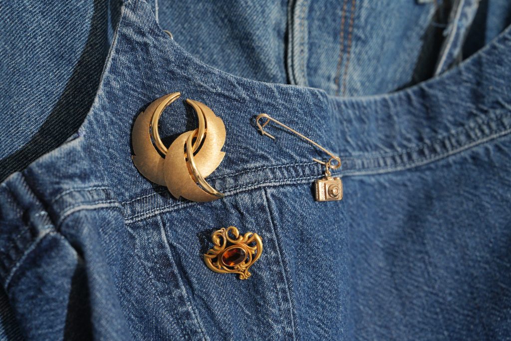 brooch travel collection jumble of three pins a camera and safety pin and circle swirl brooch and antique citrine pin