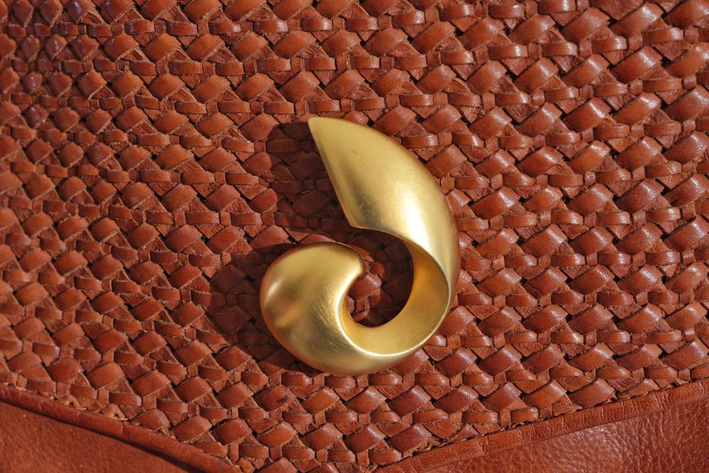 brooch travel gold swirl on brown leather purse