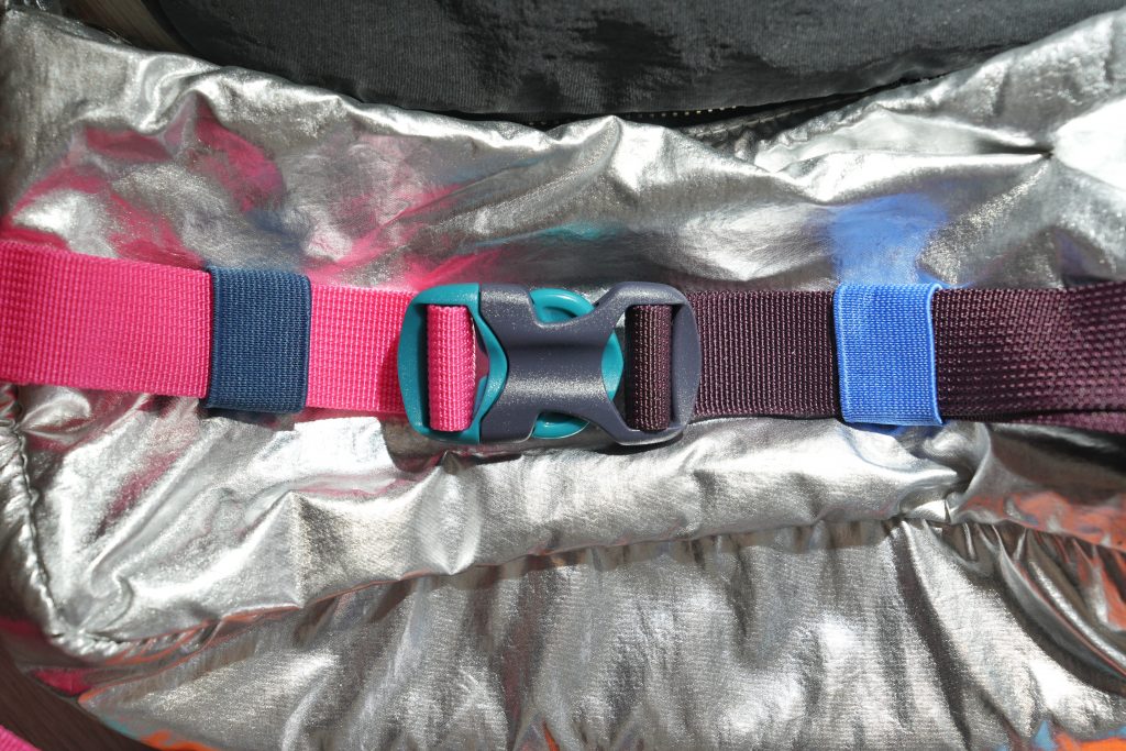 colorful fanny packs silver pink blue cotopaxi buckle Why the Best Bag for Solo Travel is a Fanny Pack