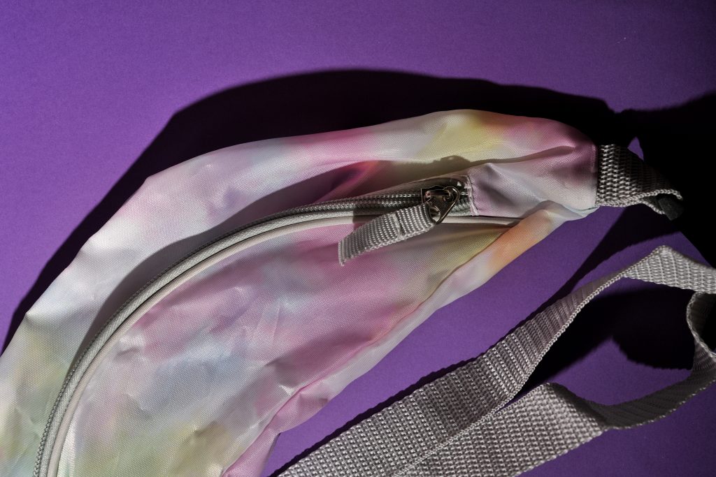 colorful fanny packs tie die gray Why the Best Bag for Solo Travel is a Fanny Pack