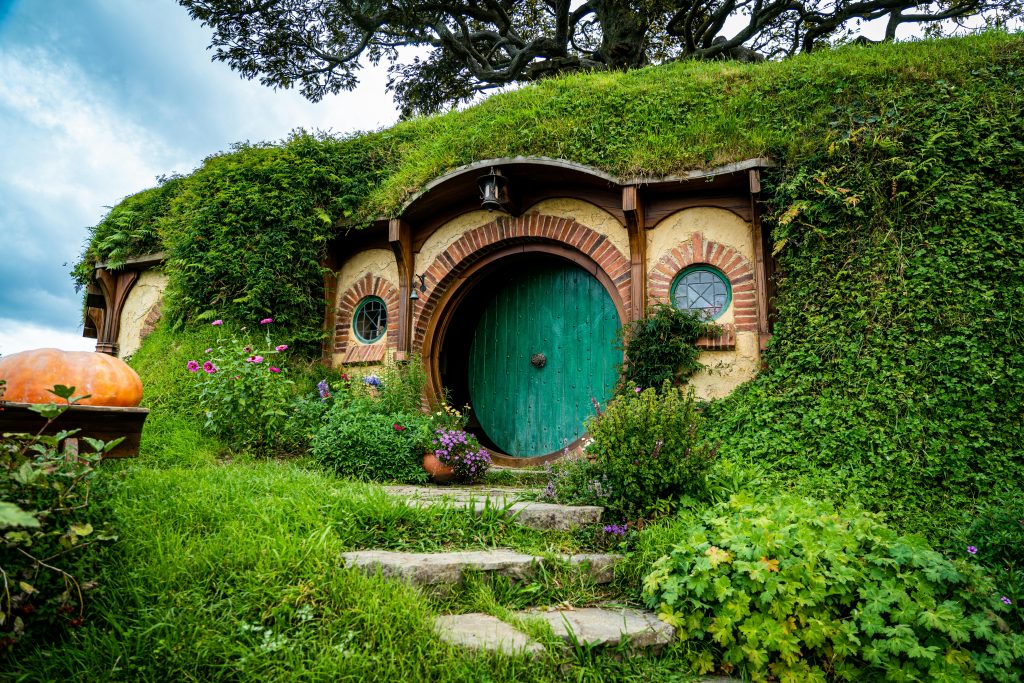Shire green round door in the earth hobbit homes