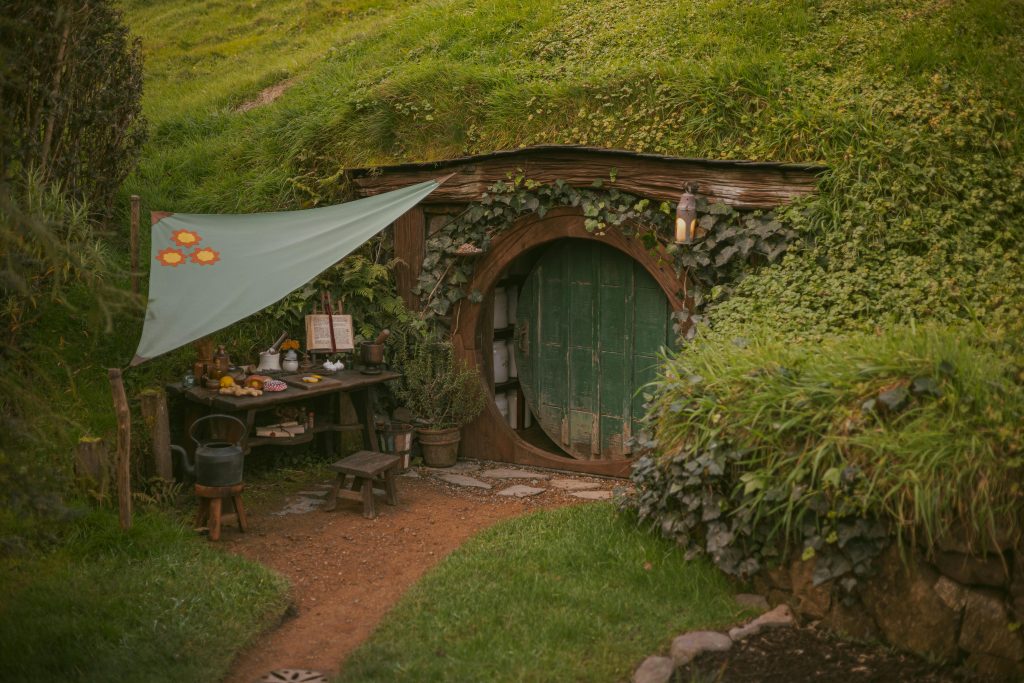 Shire green round door in the earth hobbit homes