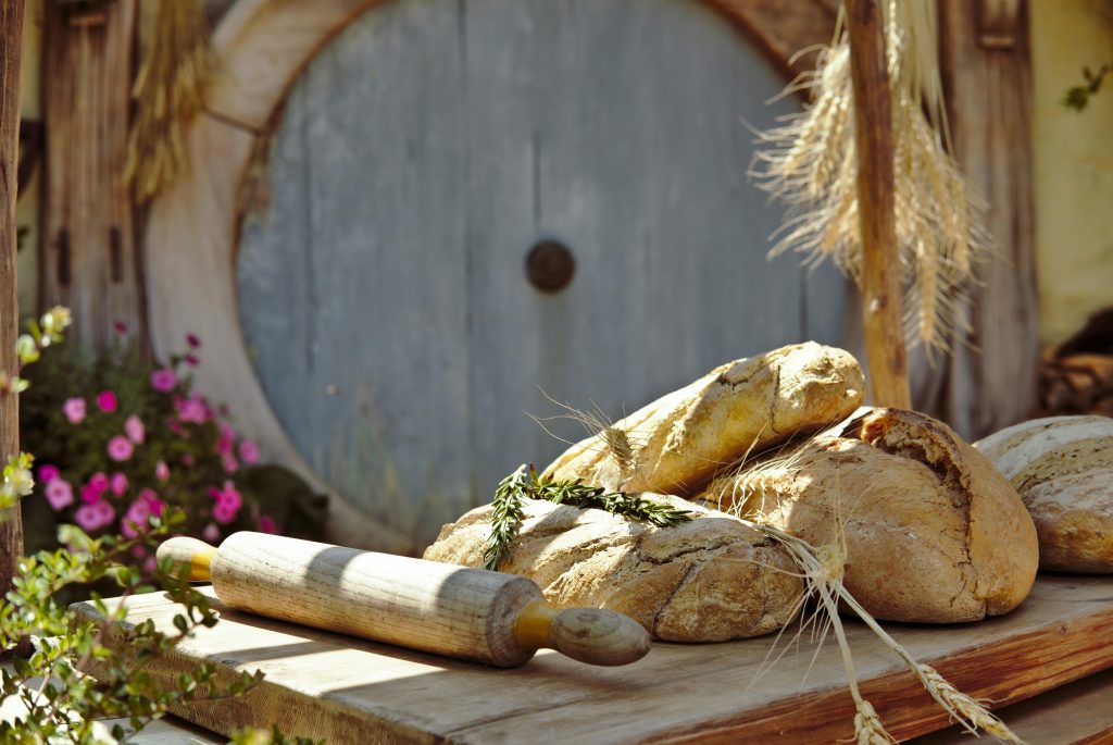 breads and rolling pin in front of Shire round door