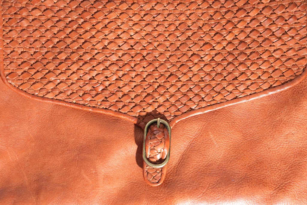 brown woven leather top purse clasp buckle