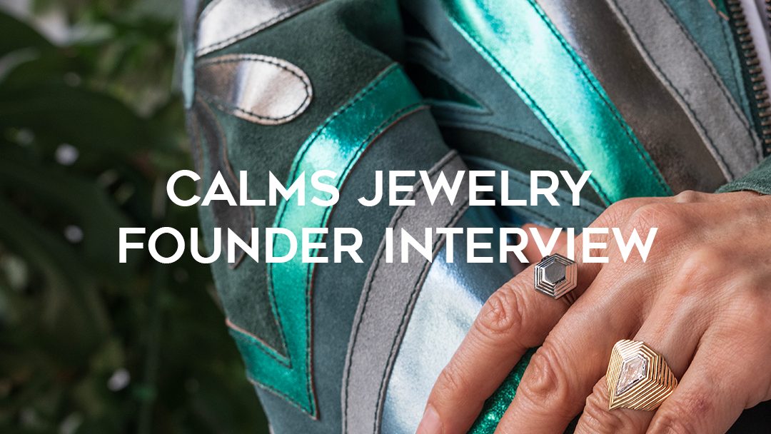 Calms Jewelry Founder Interview text over shiny green suede jacket with hand wearing two Calms rings